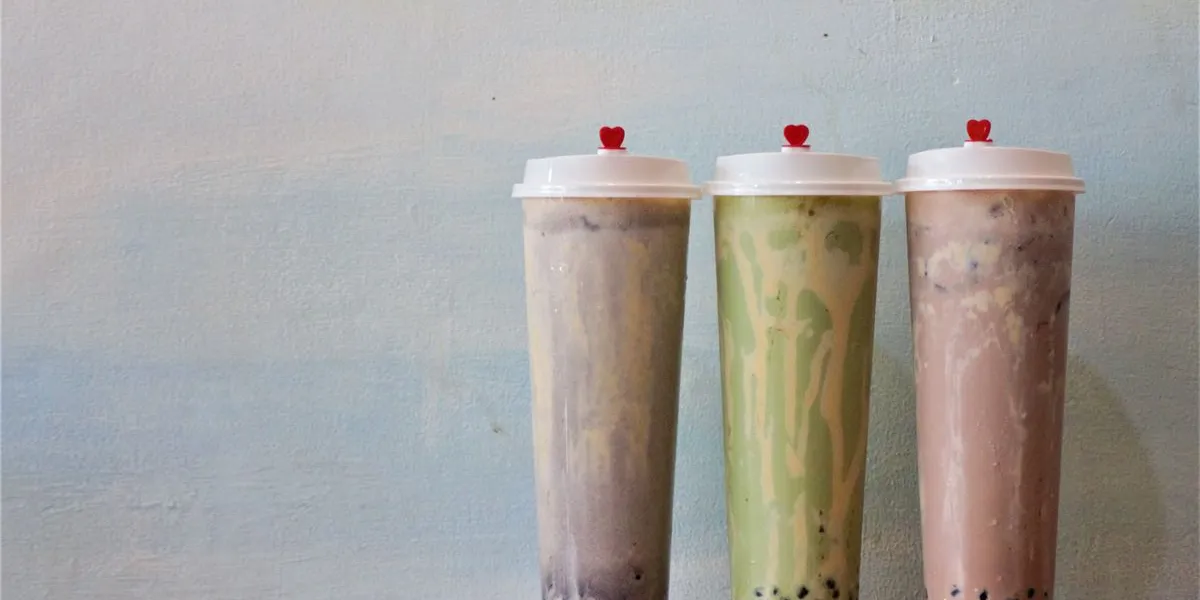 Three bubble tea cups in different flavors — decorative stock image