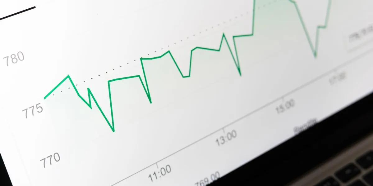 A green line chart trending over time on a screen — decorative stock image