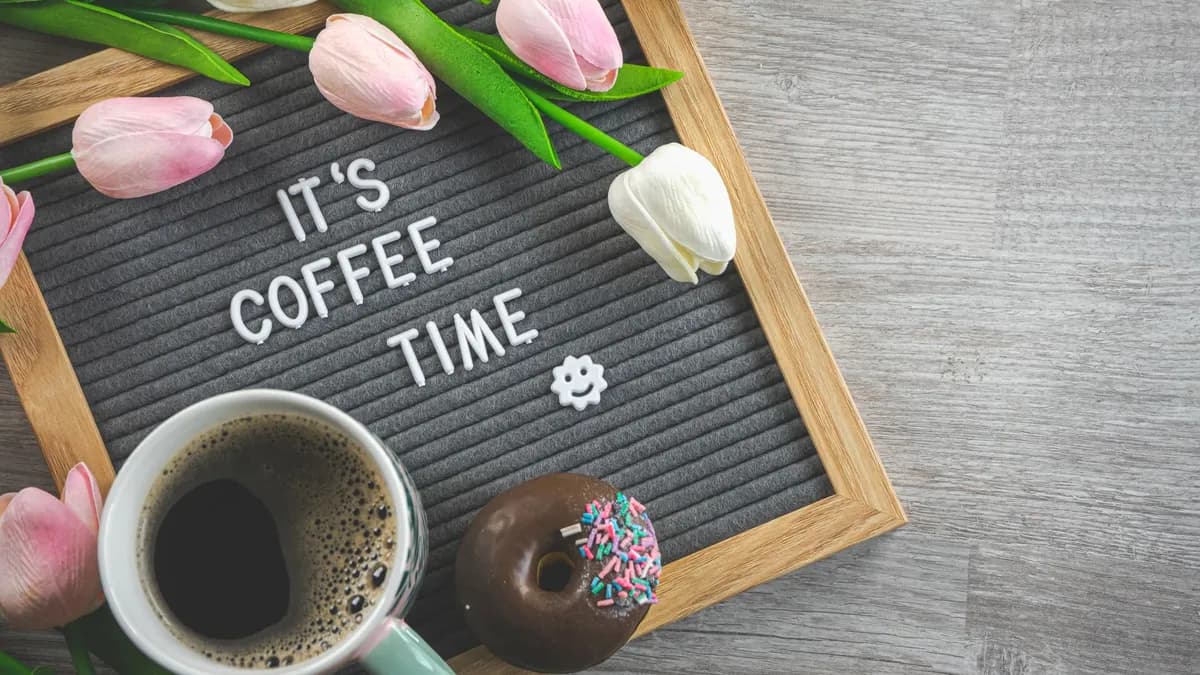 Coffee and a donut — decorative stock image