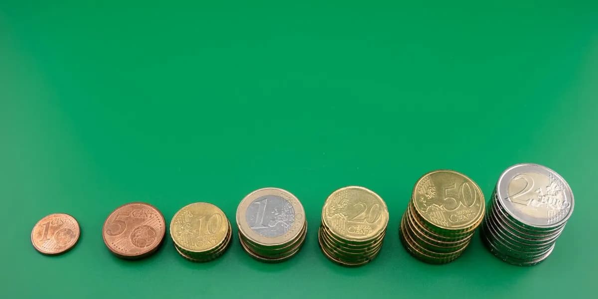 Euro coins stacked in ascending steps from one cent to two euro — decorative stock image